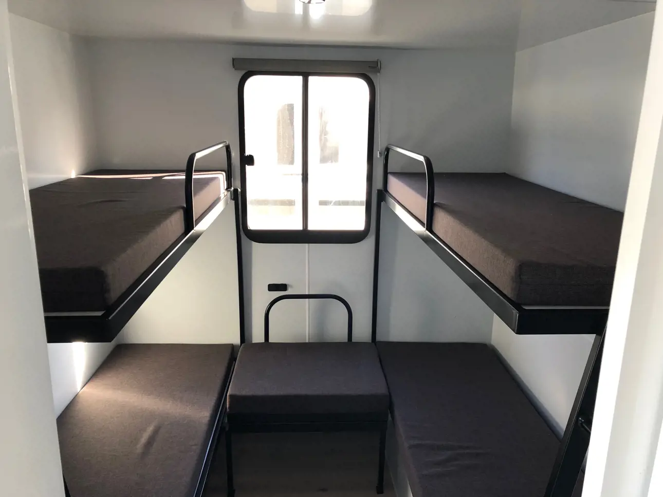 2 spacious bedrooms with 4 single bunks in each